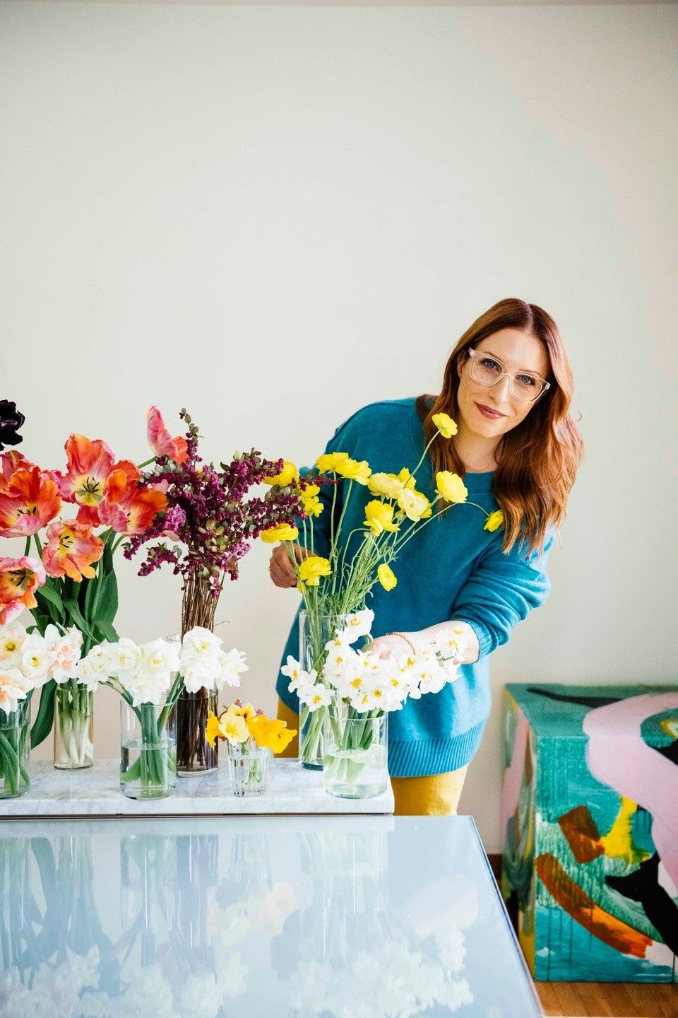Susan McLeary arranging flowers in her studio